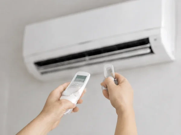 An Ad Aircond Solution technician taking readings during a scheduled aircond maintenance visit in Kuala Lumpur.